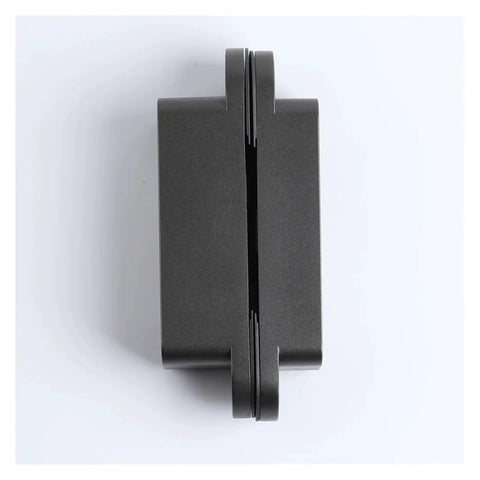 3D Adjustable Invisible Hidden Door Hinge In Black Finish For Cabinets And Furniture, top view on white background.