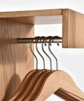 Heavy Duty Solid Wood Wall Mounted Coat Rack With Reinforced Metal Hooks, featuring wooden hangers and a metal rod for organized storage.