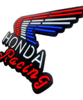 Wing-shaped LED sign with 'Honda Racing' in red, white, and blue glowing neon tubes on a black background.