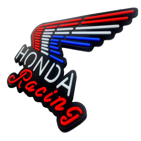 Wing-shaped LED sign with 'Honda Racing' in red, white, and blue glowing neon tubes on a black background.
