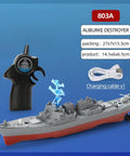Remote Control Warship RC Battleship 2.4GHz Boat For Lakes And Rivers Dope Armed Arleigh Burke Class Destroyer Model With Low Battery Reminder Realistic Detailing Easy Steering Durable Waterproof Hull For Adults showing remote and charging cable