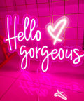Neon Sign Wall Art Light for Bedroom Bar Pub Club Rave Decor 60x37cm, "Hello Gorgeous" pink sign on grid backdrop.