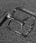 Close-up of Nine Sixteenth Inch MTB Bike Pedals With Sealed Bearings, Aluminum Alloy Flat Pedals showing left marking