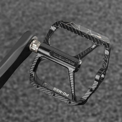 Close-up of Nine Sixteenth Inch MTB Bike Pedals With Sealed Bearings, Aluminum Alloy Flat Pedals showing left marking