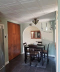 Glue Up Foam Ceiling Tiles White Pack Of Eight Covering 21.6 Square Feet Lightweight Insulating Popcorn Ceiling Cover Paintable With Water Based Paint Easy To Install And Clean in a dining area