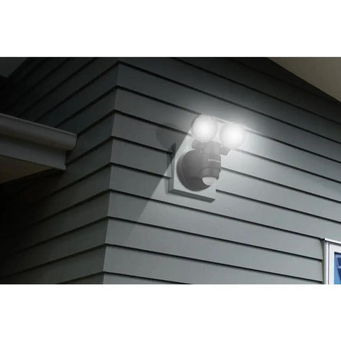 Two Head LED Outdoor Motion Activated Flood Light In Black, 180 Degree Coverage, 1100 Lumens, Easy Wall Mount Install on house corner