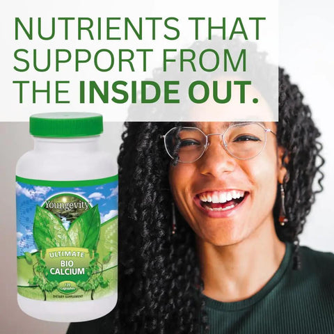 Bottle of Bio Calcium Chelated Mineral Complex With Magnesium Zinc Copper Potassium Boron For Boss Absorption And Bone Health Keeps Your Bones Dense And Strong Absorbable Calcium Supplement 120 Capsules next to smiling person.