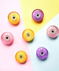 Colorful roller skate wheels on pastel background, include Roller Skate Wheels Four Pack PU High Rebound Outdoor 82a Purple Quad Replacement Parts