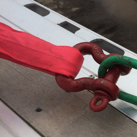 Heavy Duty 10 Foot Red Round Sling For Lifting, Towing And Recovery, Vertical 13,200 Lb SWL attached to metal hook on platform