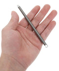 Hand holding a single 6 Piece Stainless Steel Extension Spring With Double Hook Ends heavy duty spring for garage door systems.