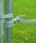 Installed chain link gate fork latch with padlock hole, galvanized fence latch for gates, kennels and runs, farm fencing.