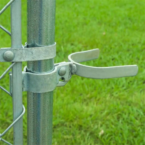 Installed chain link gate fork latch with padlock hole, galvanized fence latch for gates, kennels and runs, farm fencing.