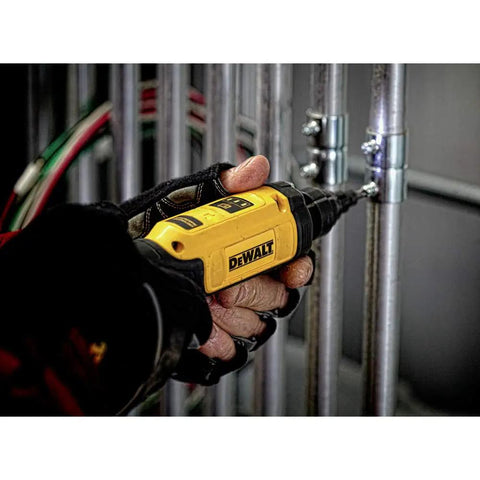 Close-up of a person using 8V Max Cordless Screwdriver with Gyroscopic Control and Conduit Reamer on metal pipes.