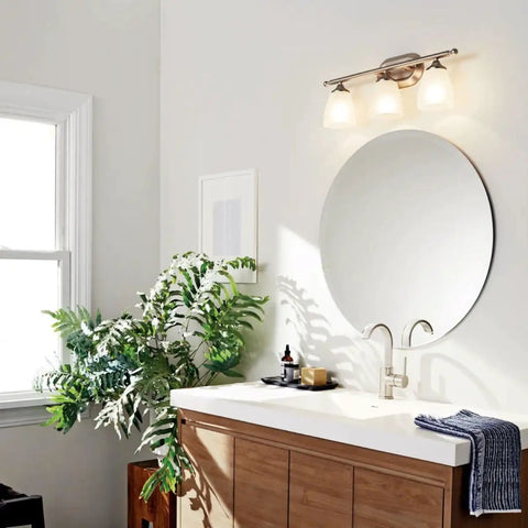 Bathroom with Ansonia 23-Inch Three Light Vanity Fixture With Satin Etched Glass And Brushed Nickel Finish above mirror