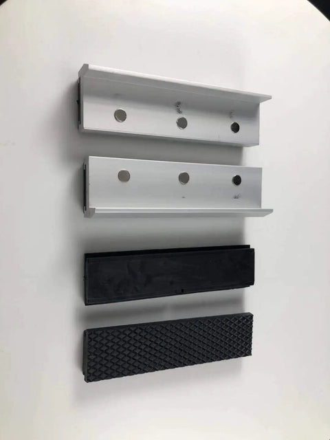 Top view of Magnetized Aluminum Alloy Rubber Soft Vise Jaws For Any Metal Vise 4 Inch with embedded magnets and spare rubber pair.
