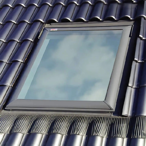 Edw M02 Skylight Flashing Top Shelf Solution For High Profile Tile Roofs Featuring Adhesive Underlayment on a tiled roof with blue sky.