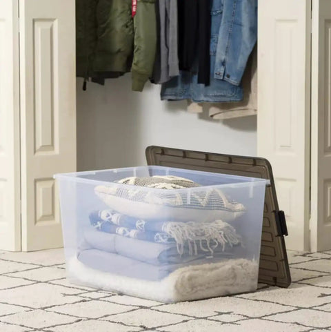 Big Ticket Clear Storage Bins 144 Quart 3 Pack Stackable Containers With Snappy Buckles Grooved Lid Handles Every Heavy Haul For Zero Drama Household Organization with stacked blankets and pillows.