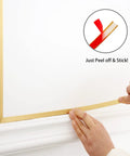 Applying Matte Gold Peel And Stick Molding Trim on wall; shows easy self-adhesive application with flexible trim edge.