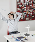 Hands On Solar Windmill Kit For Kids Easy Assembly Mini Wind Turbine on a desk with child in background.
