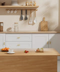 Modern kitchen featuring Premium Brushed Brass Cabinet Knobs 2 Inch Dresser Pulls Hardware Set 12 Pack on white drawers.