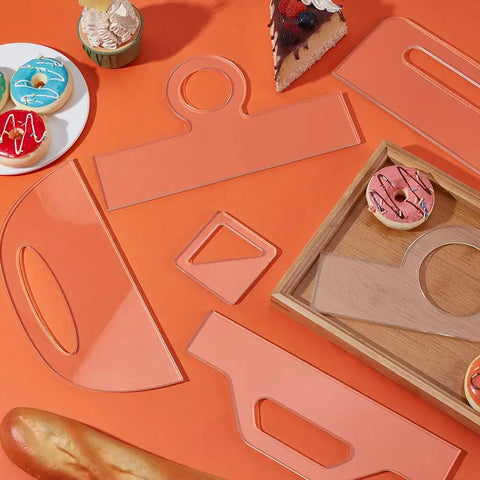 High Density Acrylic Charcuterie Board Templates Six Piece Router Stencil Set With Grippy Handles on orange table with pastries.