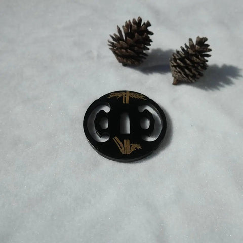 Samurai Sword Koshirae Tsuba Iron Carved 001-026 TDH 026 hand guard on snow with pine cones