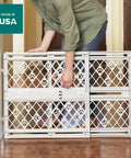 Slick Expandable Portable Pet Gate For Doorways Features No Sweat Pressure Mount Installation Fits 26 To 40 Inches Wide And Stands 23 Inches Tall for indoor use.