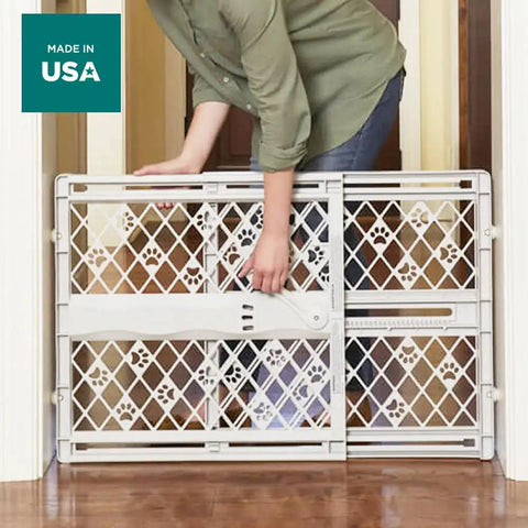 Slick Expandable Portable Pet Gate For Doorways Features No Sweat Pressure Mount Installation Fits 26 To 40 Inches Wide And Stands 23 Inches Tall for indoor use.