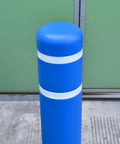 Tough As Nails Blue Safety Bollard Cover 6 Inch Wide 46 Inch Tall with reflective tape protecting a pole in a commercial area.