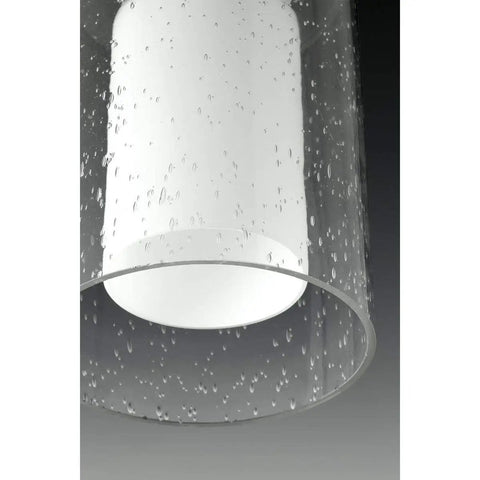 Close-up of Double Glass Pendant Light With Oversized Seeded Glass And Inner Etched White Shade One Light Polished Chrome Finish