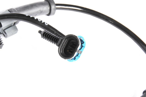 Close-up of the connector for the Straight Up Oem Grade Front Wheel Speed Sensor Direct Bolt On Replacement.