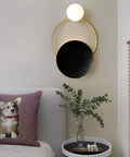 Fresh Modern LED Wall Sconce With Sturdy Iron Body, Up And Down Illumination Creates A Chill Ambient Vibe For Bedrooms, Bathrooms Or Halls, Warm Wash Light Is An Instant Upgrade For Any Home Setup Today mounted above a bed with a decorative pillow and plants.