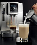 Fully Automatic One Touch Coffee Maker Bean To Cup Espresso Machine For Home Office Adjustable Silent Grinder Detachable Tank Super Easy Cleanup Nails Your Daily Grind in action pouring milk into a glass.