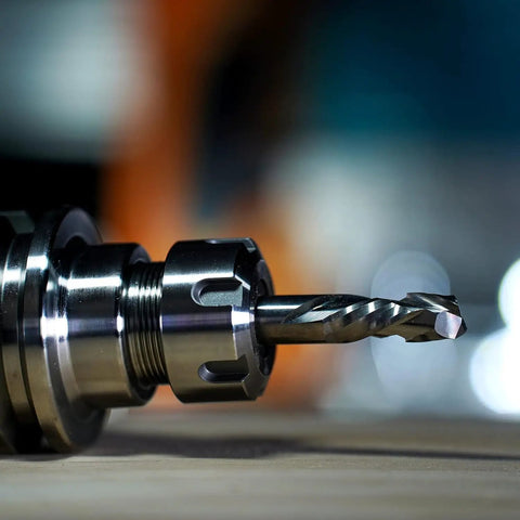 Close-up of a carbide compression router bit with 1/4 inch shank, part of the Compression Router Bits Set Five Pieces With One Quarter Inch Shank And One Quarter Inch Cutting Diameter Carbide Up Down CNC Router Bits For Woodworking Carving Slotting And Edge Cutting Pro Grade Durability And Clean Tear Free Cuts.