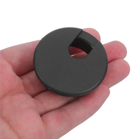 Rock This Black 60 Piece Cable Management Kit With Square Hole Covers To Keep Your Desk Wire Organized And Tangle Free For A Squeaky Clean Home Office Setup black plastic round cable grommet in hand