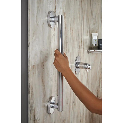 Hand holding contemporary 18 inch chrome grab bar for bathroom safety, built tough to support up to 450 lbs, ideal for shower use.