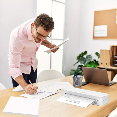Man using Bulk Pack 100 Sheets 8.5x11 US Letter Thermal Printer Paper For On The Go Portable Printers in office setting