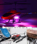 Red Large Fall Resistant RC Helicopter With Three Point Five Channels Remote Control LED Night Light Includes Two Batteries Gyro Stabilization For Smooth Flights Durable Alloy Frame Easy Operation For Beginners And Hobbyists glowing in dark setting with close-up on durable frame.