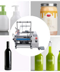Hassle Free Manual Round Bottle Labeler With Adjustable Dispenser And Wide Applicator Handles 20 To 40 Bottles Per Minute shown with various cylindrical containers.