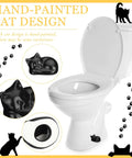 Two Cat Shaped Toilet Bolt Caps Ceramic Screw Covers For Bathroom Decor, 2 Pack Black, shown on a toilet.