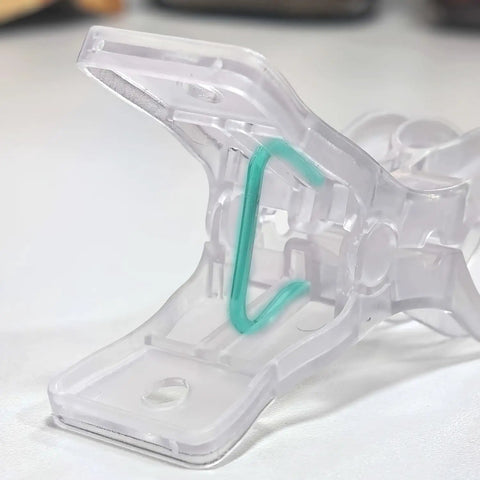 Close-up of a Premium Ten Pack Of Heavy Duty Spring Clips Measuring 3.5 Inches Featuring Transparent Plastic build.