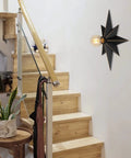 16 Inch Industrial Black Metal Star Flush Mount Ceiling Light With Vintage Farmhouse Vibe installed in a modern hallway setting.