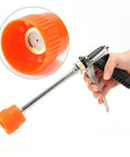 Beefy Zinc Alloy Sprayer Wand With Long Rod High Pressure Water Spray held in hand, close-up of orange nozzle and trigger detail.