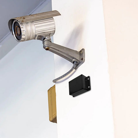 Durable Waterproof Outdoor Electrical Box Plastic Enclosure With Fixed Ear 115x90x55mm Black installed on white wall with security camera