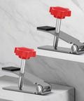 Heavy Duty Tile Lifter With Adjustable Arm Jack And Triangular Load Bearing Base Plus Hassle Free Fine Tune Knobs showing red knobs and steel construction.