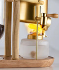 Top Shelf Belgian Siphon Coffee Maker With Clear Glass Chamber And Sleek Silver Base for rich flavor extraction.