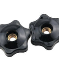 Close-up of two black M6 star knob fixtures with durable plastic and copper core for machinery, through hole design.