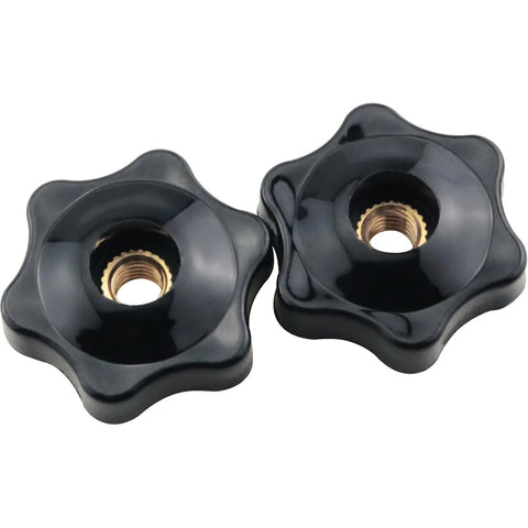 Close-up of two black M6 star knob fixtures with durable plastic and copper core for machinery, through hole design.