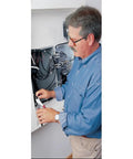 Person using J228-8 Diagonal Cutting Pliers, 8-Inch, High Leverage With Short Jaws on electrical wires in a panel