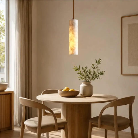 Alabaster Pendant Light Natural Marble Long Tube Hanging Lights with Wood Ceiling Canopy Modern Nordic Mini Pendant Lamp for Kitchen Island Bedroom Hallway(25 * 6cm) above a round wooden dining table.